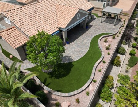 A bird 's eye view of a backyard with a lawn.