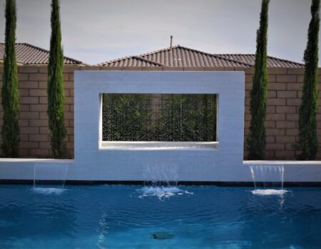 A pool with water jets and a wall